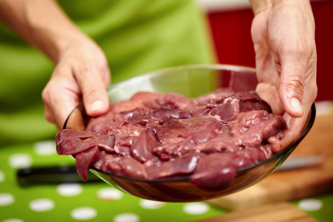 Image showing a woman holding a bowl full of raw-organ-meat-dog-food